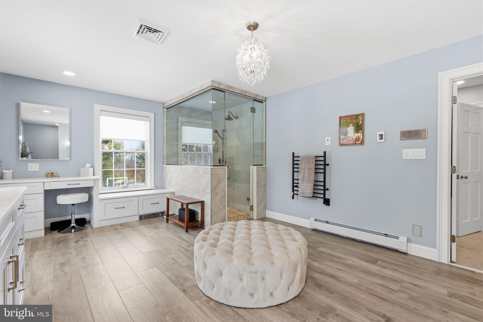 7 Woodland Road Newtown, PA 18940 - Photo 68 of 137 a view of a livingroom with furniture a fireplace wooden floor and windows