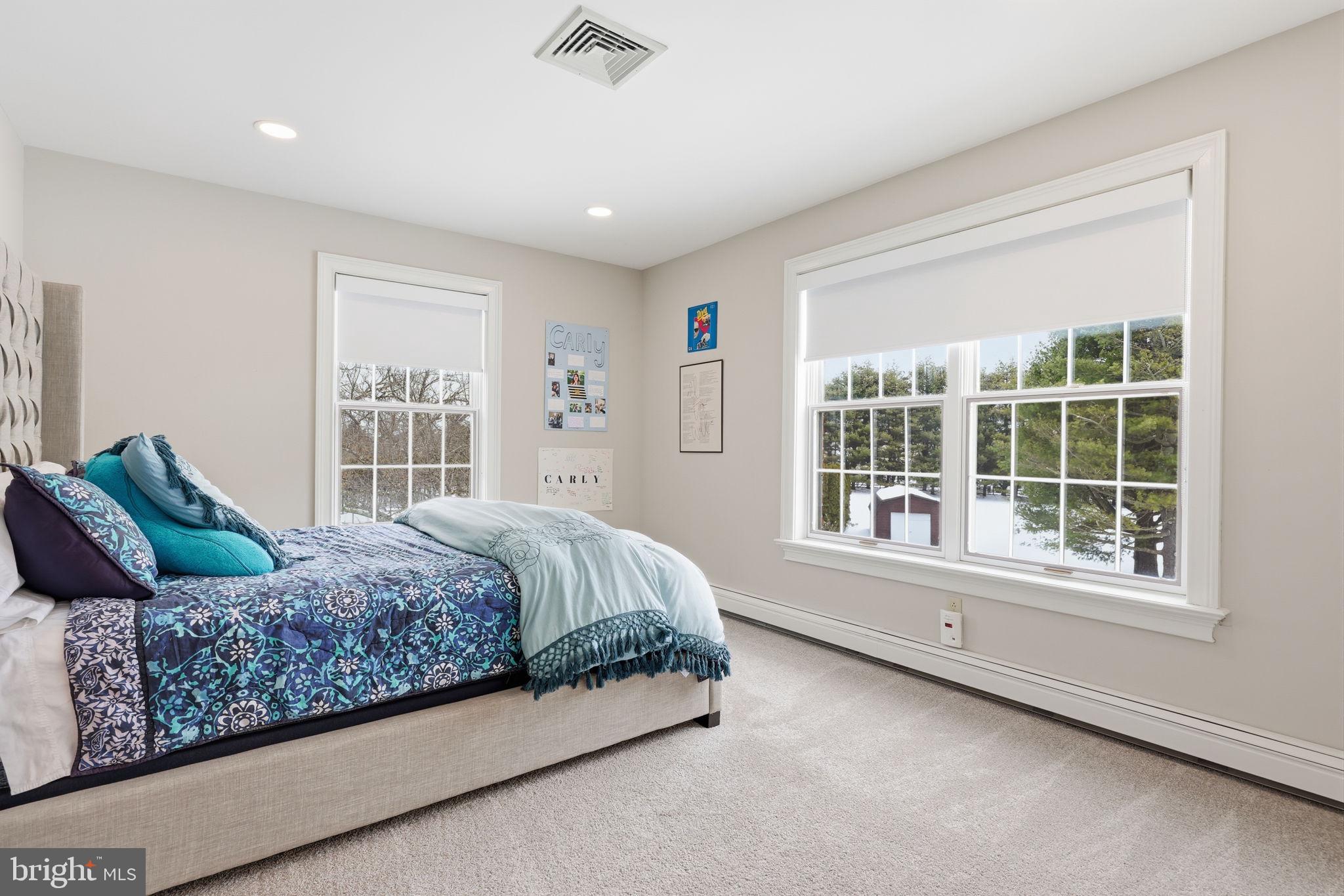 7 Woodland Road Newtown, PA 18940 - Photo 96 of 137 a bedroom with a large bed and a large window