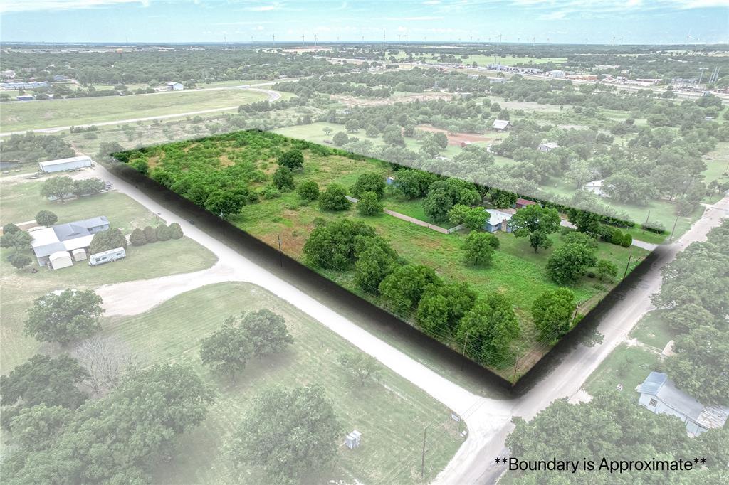510 Hamby Road Clyde, TX 79510 - Photo 1 of 34 Expansive lot with varied topography, including open grassy areas and dense tree coverage