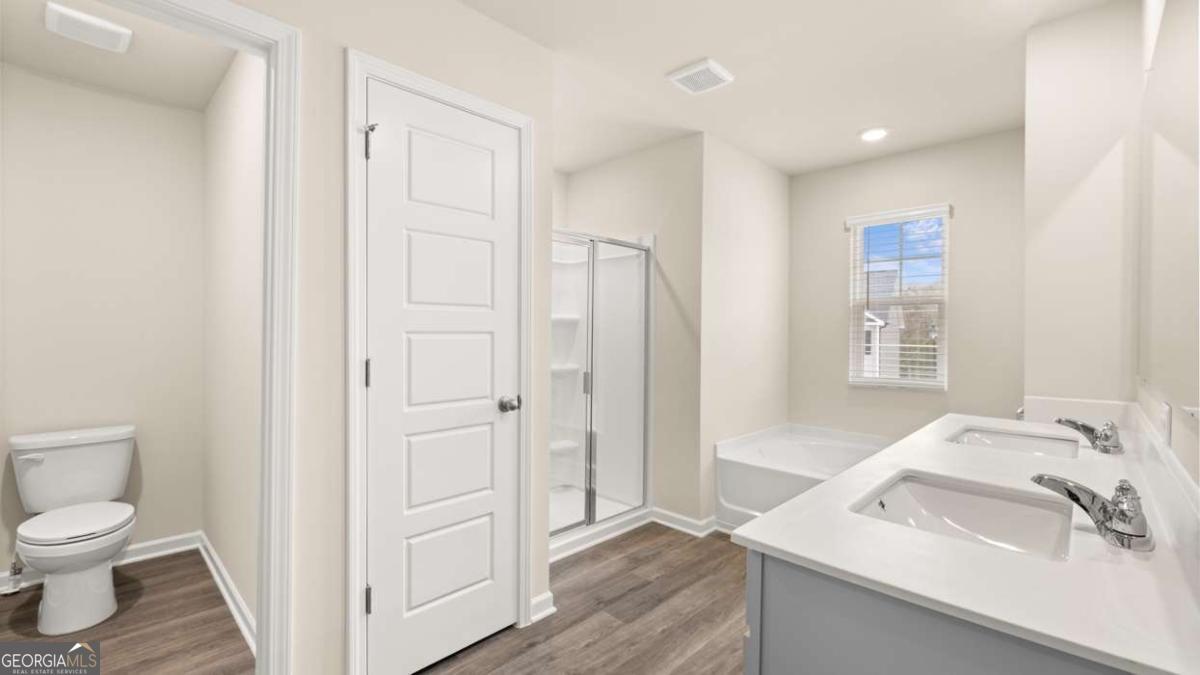 208 Cattle Drive Perry, GA 31069 - Photo 16 of 37 a bathroom with a sink and a toilet