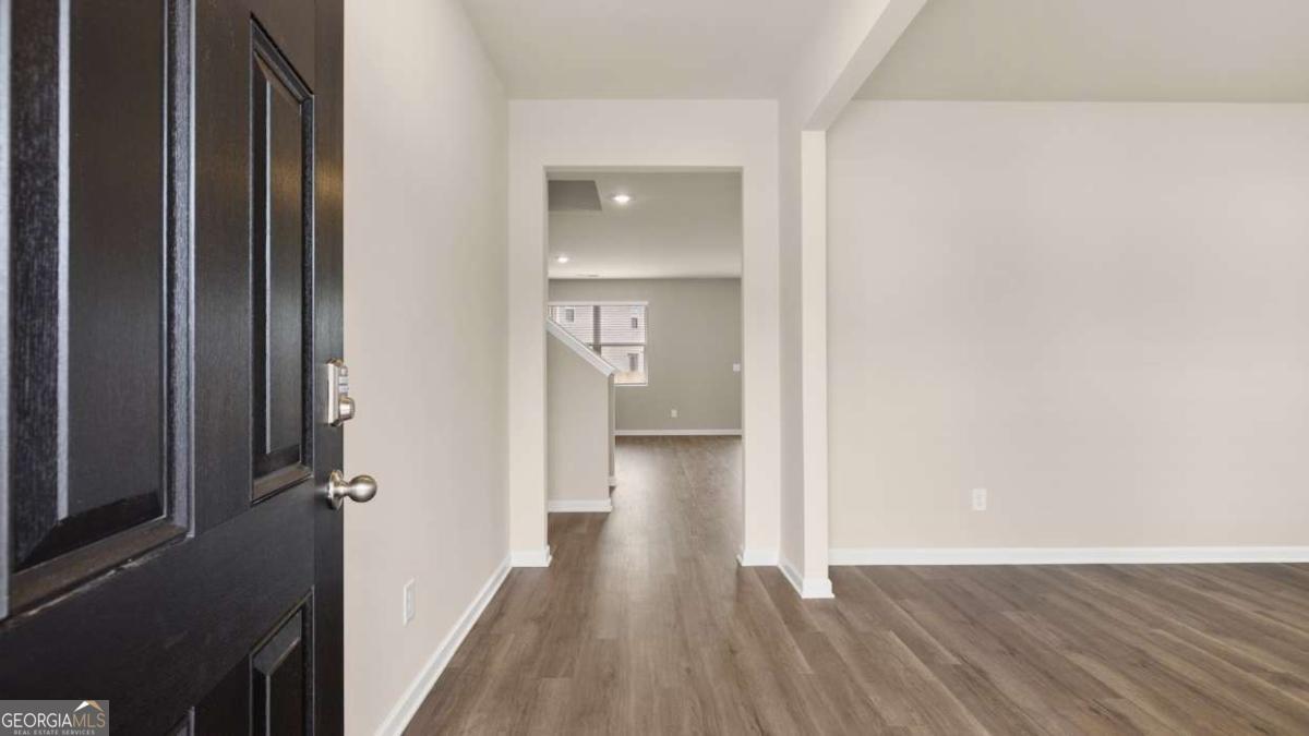 208 Cattle Drive Perry, GA 31069 - Photo 21 of 37 a view of a hallway with wooden floor