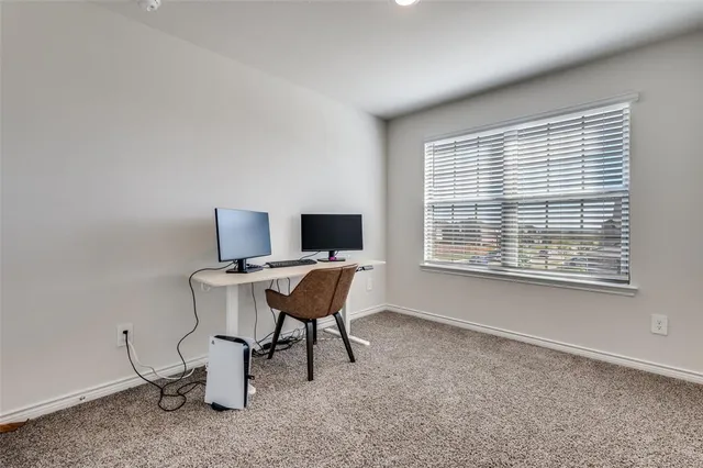 a workspace with furniture and a window