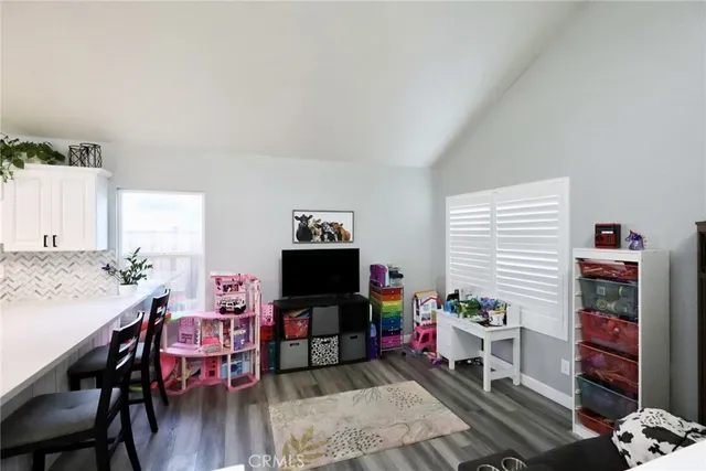a livingroom with furniture and a flat screen tv