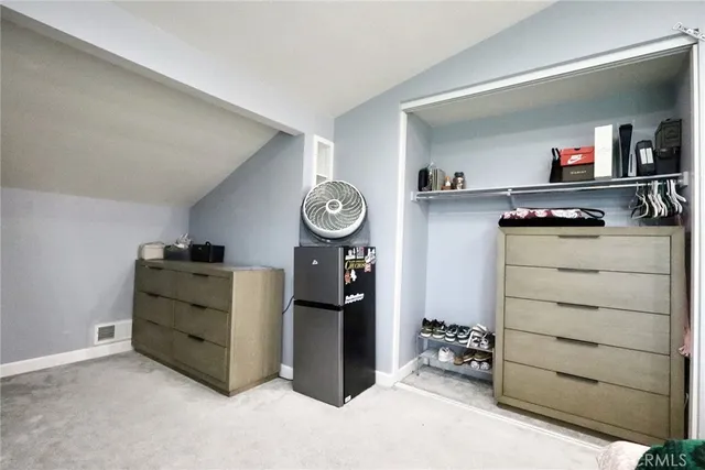 a room with furniture and a closet