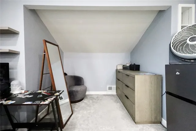 a room with a chair and a stove