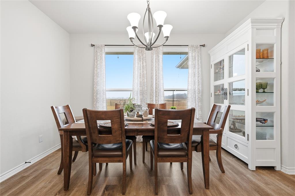 1292 Whiskey Hollow Road West, TX 76691 - Photo 12 of 34 Dining room featuring a chandelier and light wood-style flooring