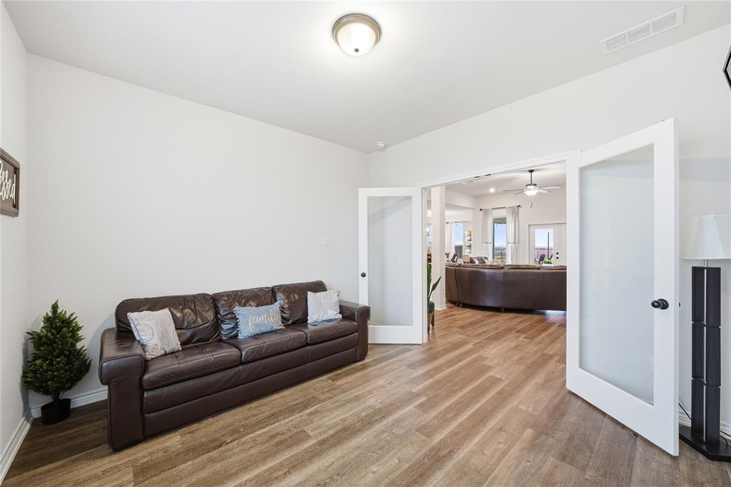 1292 Whiskey Hollow Road West, TX 76691 - Photo 13 of 34 Living room featuring french doors, wood finished floors, and a ceiling fan