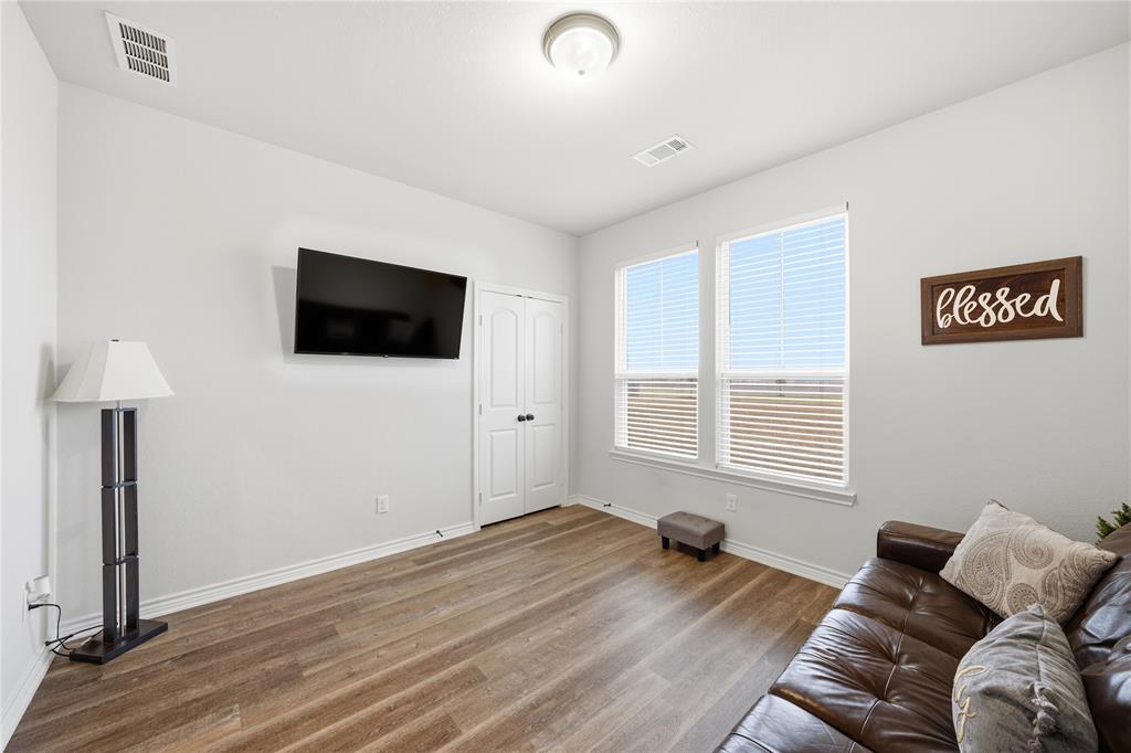 1292 Whiskey Hollow Road West, TX 76691 - Photo 14 of 34 Living area with baseboards and wood finished floors