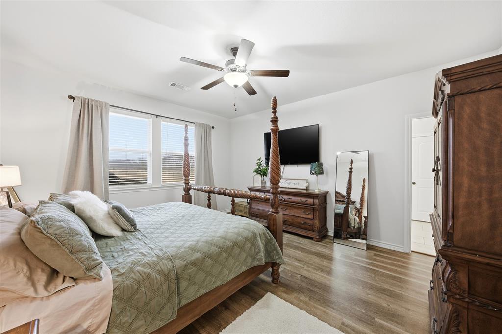 1292 Whiskey Hollow Road West, TX 76691 - Photo 15 of 34 Bedroom with wood finished floors and ceiling fan