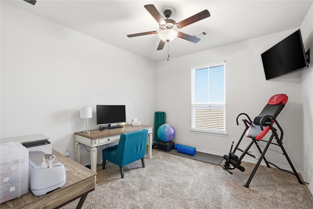1292 Whiskey Hollow Road West, TX 76691 - Photo 21 of 34 Carpeted office with ceiling fan and baseboards