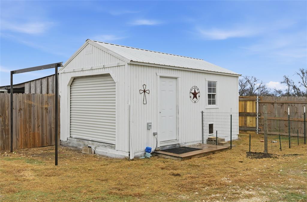 1292 Whiskey Hollow Road West, TX 76691 - Photo 31 of 34 View of outbuilding featuring a fenced backyard
