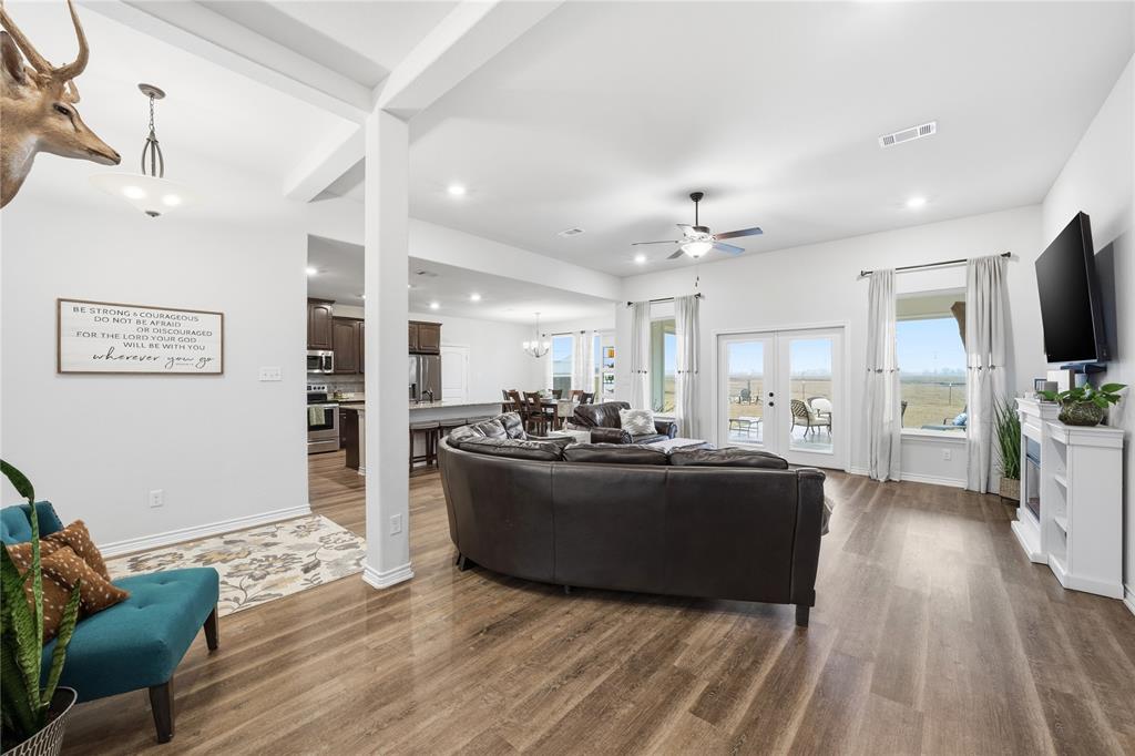 1292 Whiskey Hollow Road West, TX 76691 - Photo 8 of 34 Living room featuring a ceiling fan, dark wood finished floors, a chandelier, recessed lighting, and french doors
