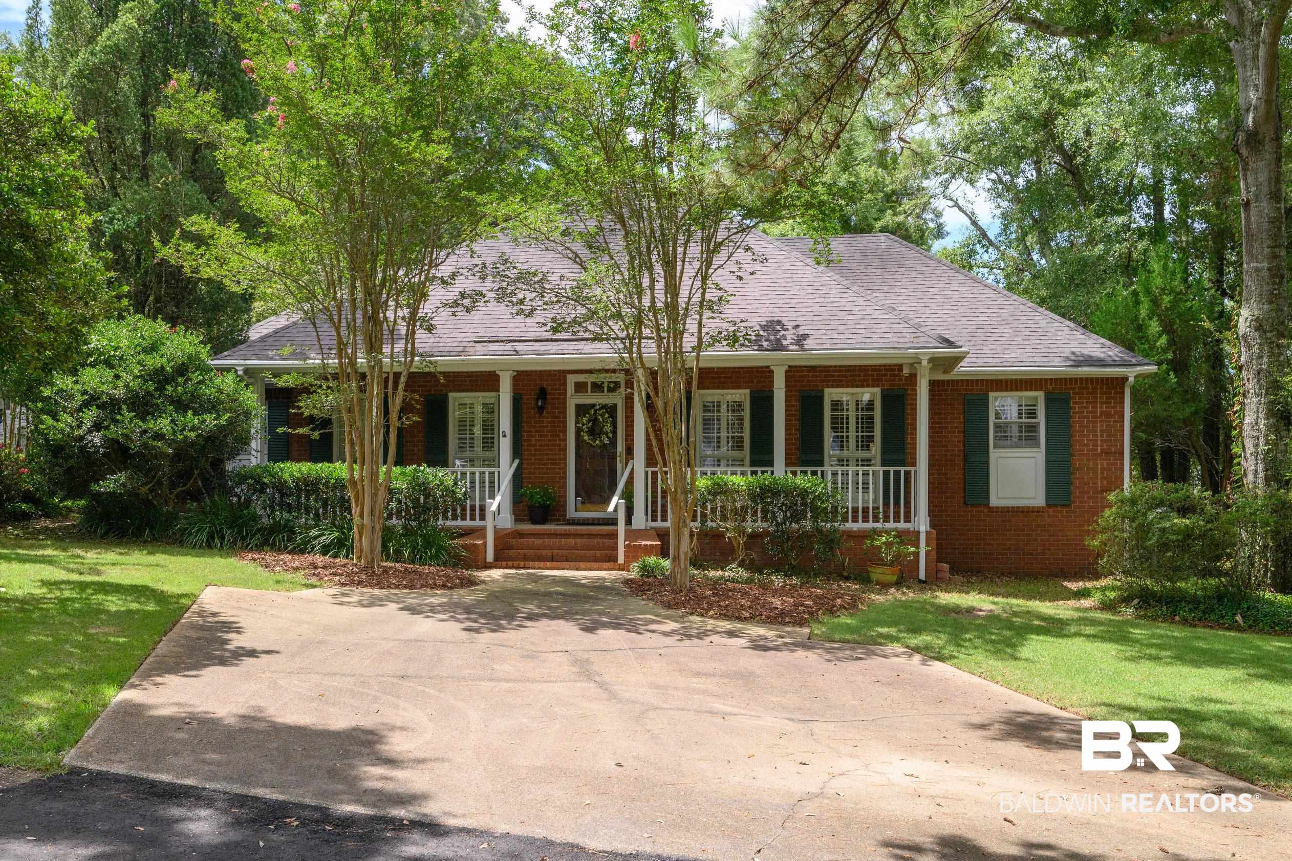6638 Jackson Square Daphne, AL 36526 - Photo 62 of 62 View of front of home featuring a porch and a front lawn