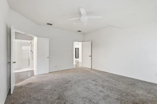 a bathroom with a double vanity sink a mirror and a bathtub