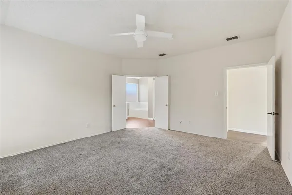 a bathroom with a shower and a bath tub