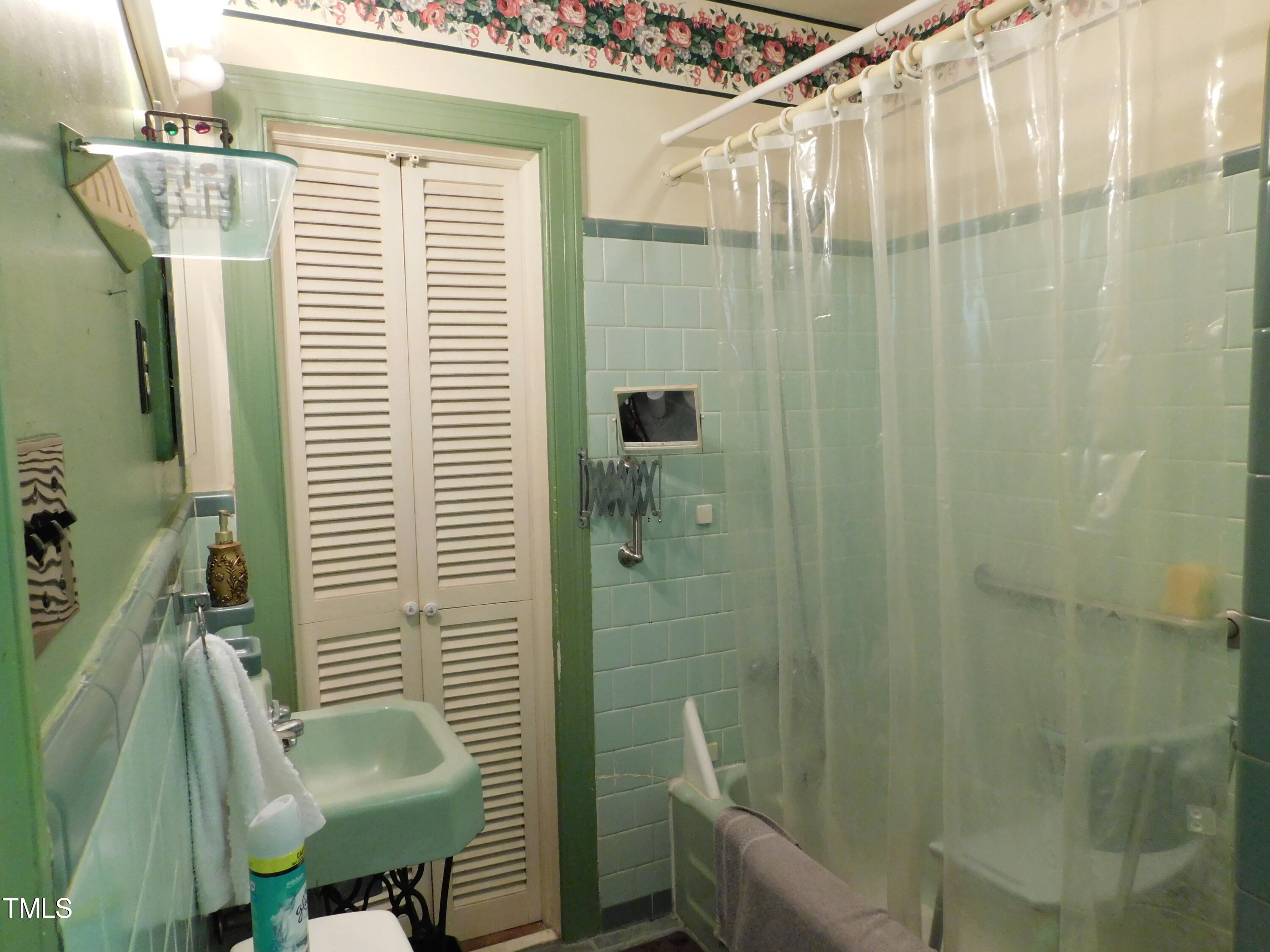 1107 Ensworth Road Northwest Wilson, NC 27896 - Photo 19 of 26 a bathroom with a shower and a sink