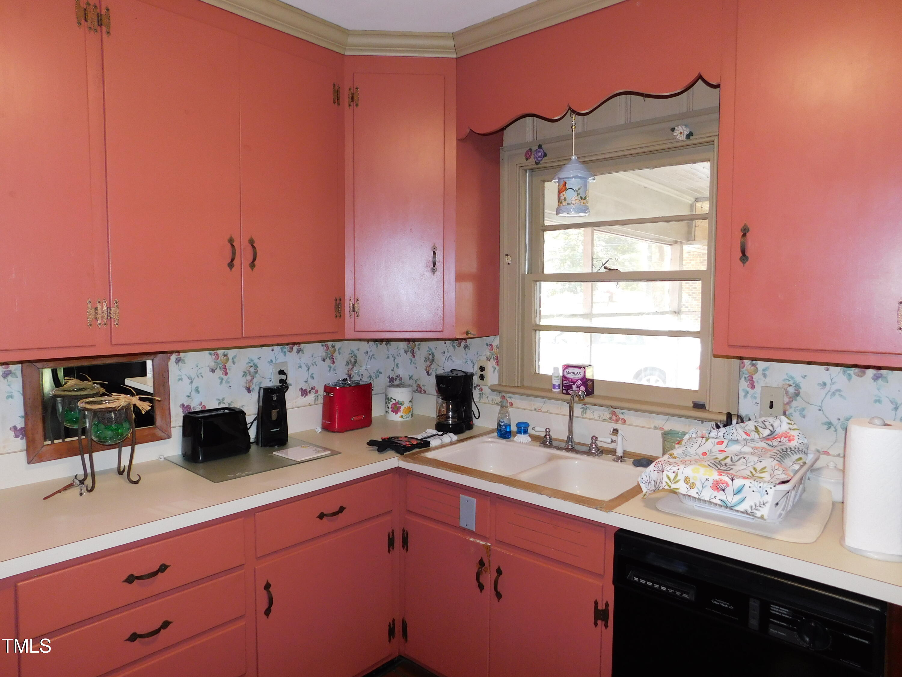 1107 Ensworth Road Northwest Wilson, NC 27896 - Photo 3 of 26 a kitchen with a sink cabinets and window
