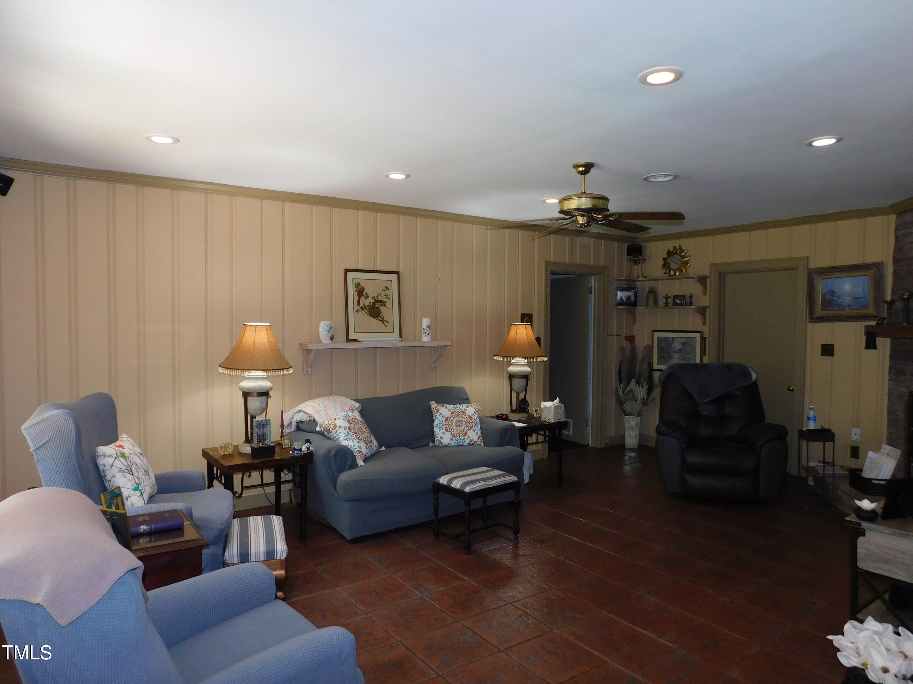 1107 Ensworth Road Northwest Wilson, NC 27896 - Photo 8 of 26 a living room with furniture and a lamp