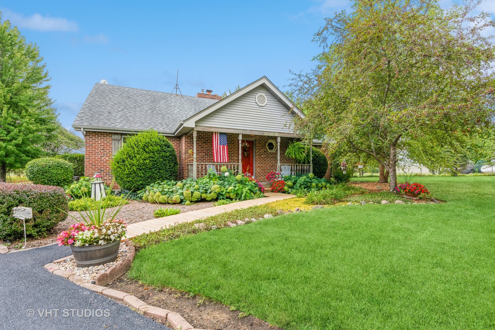 13360 West Bruns Road Manhattan, IL 60442 - Photo 1 of 32 a front view of a house with a yard and garage