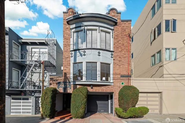 a front view of a house with barbeque grill