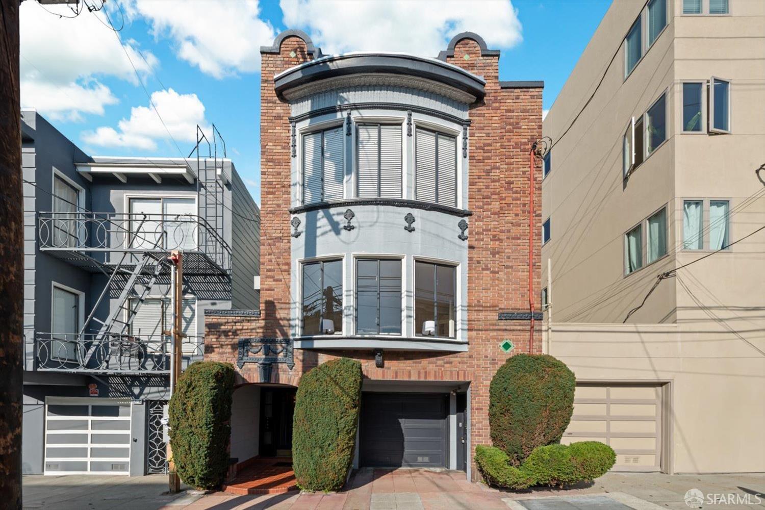 a front view of a house with barbeque grill