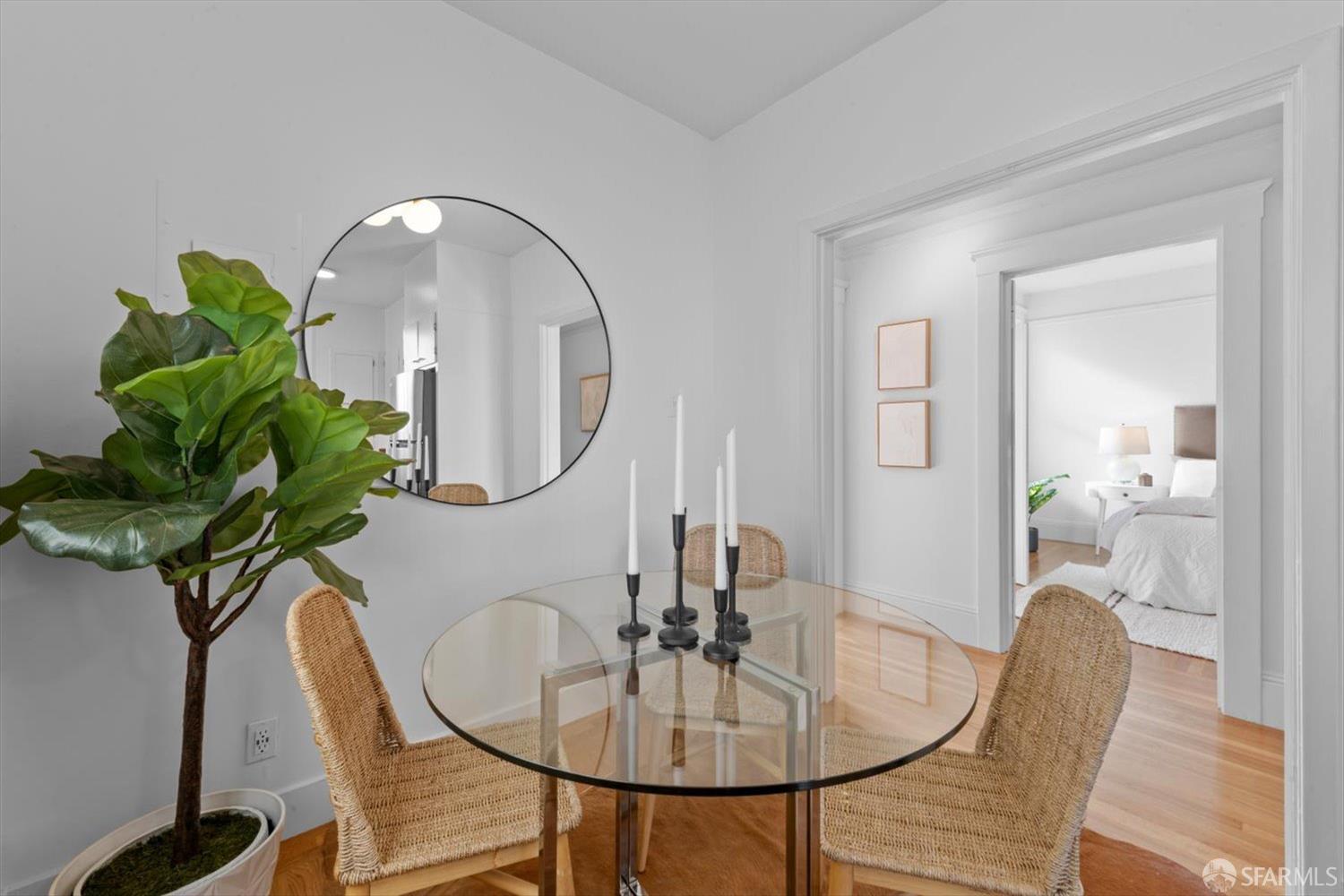 1624 Filbert Street, Unit 1 San Francisco, CA 94123 - Photo 12 of 47 a dining room with furniture and a mirror