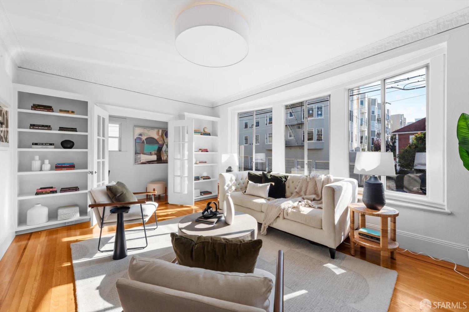 1624 Filbert Street, Unit 1 San Francisco, CA 94123 - Photo 24 of 47 a living room with furniture and a floor to ceiling window