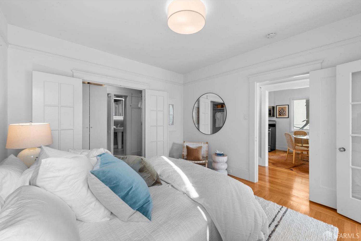 1624 Filbert Street, Unit 1 San Francisco, CA 94123 - Photo 28 of 47 a bed room with a bed mirror and a table