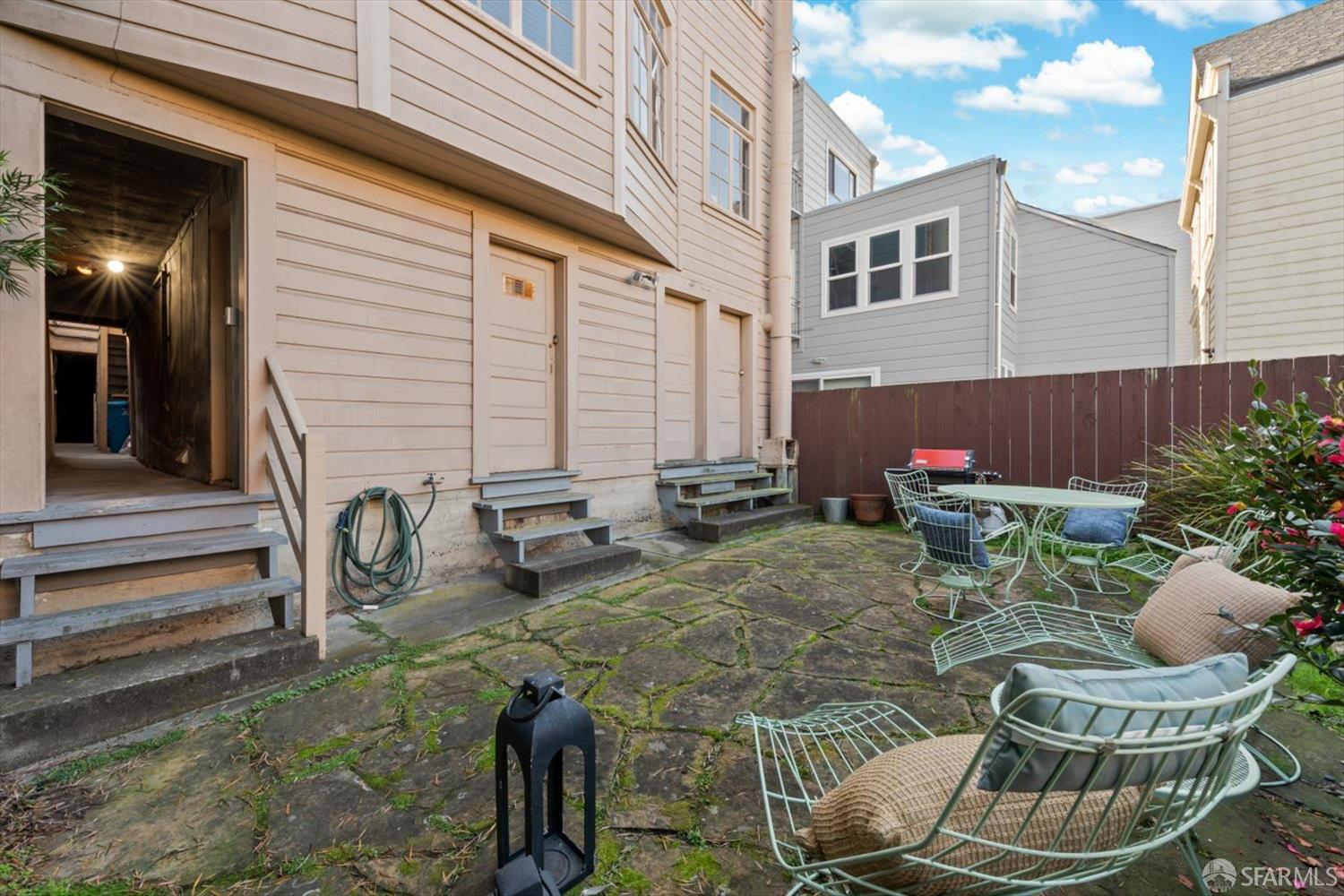 1624 Filbert Street, Unit 1 San Francisco, CA 94123 - Photo 35 of 47 a view of a patio with couches table and chairs and potted plants