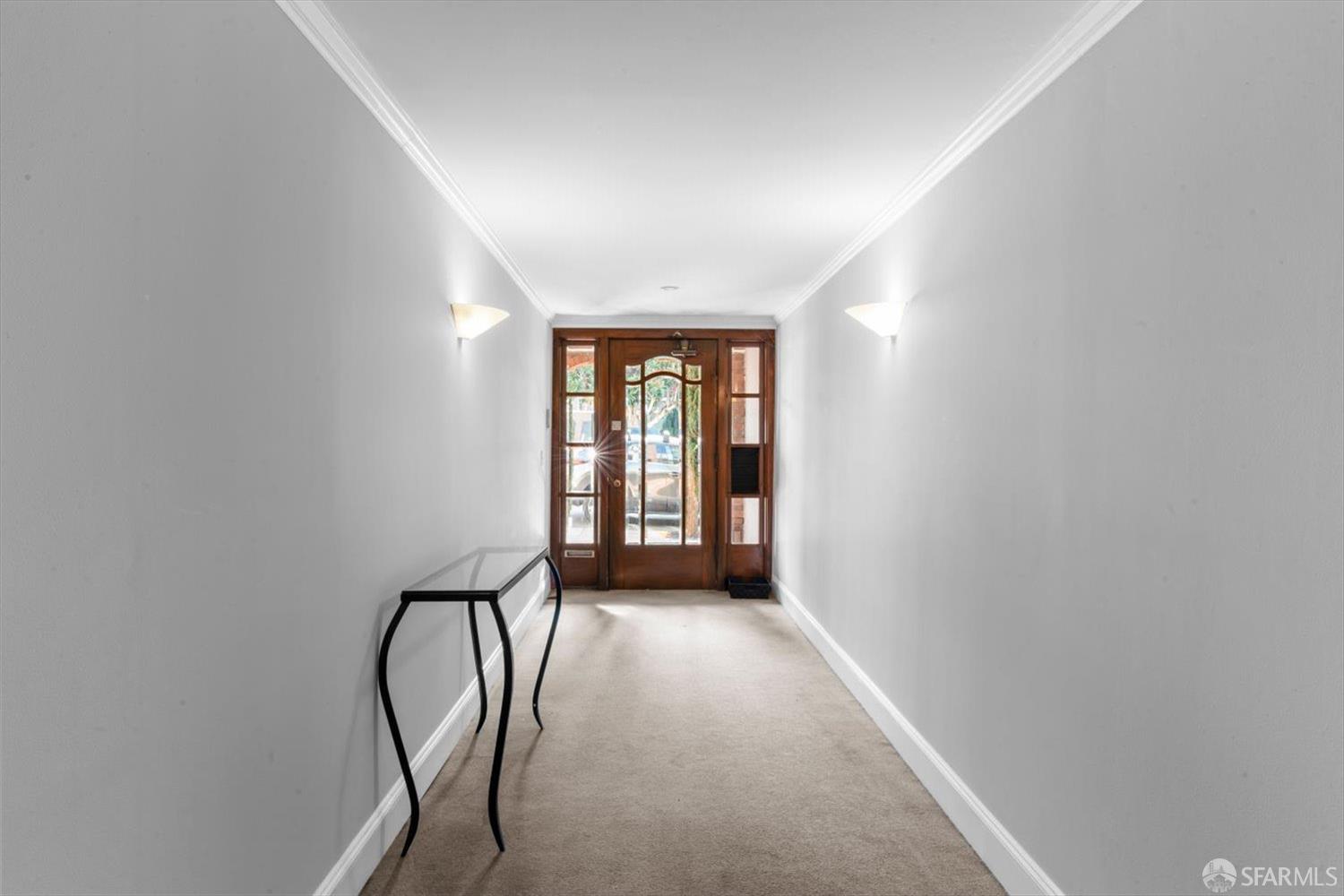1624 Filbert Street, Unit 1 San Francisco, CA 94123 - Photo 5 of 47 a view of a hallway with windows