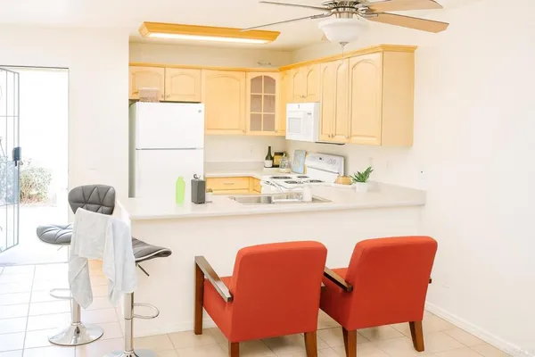 a dining room with furniture and a window