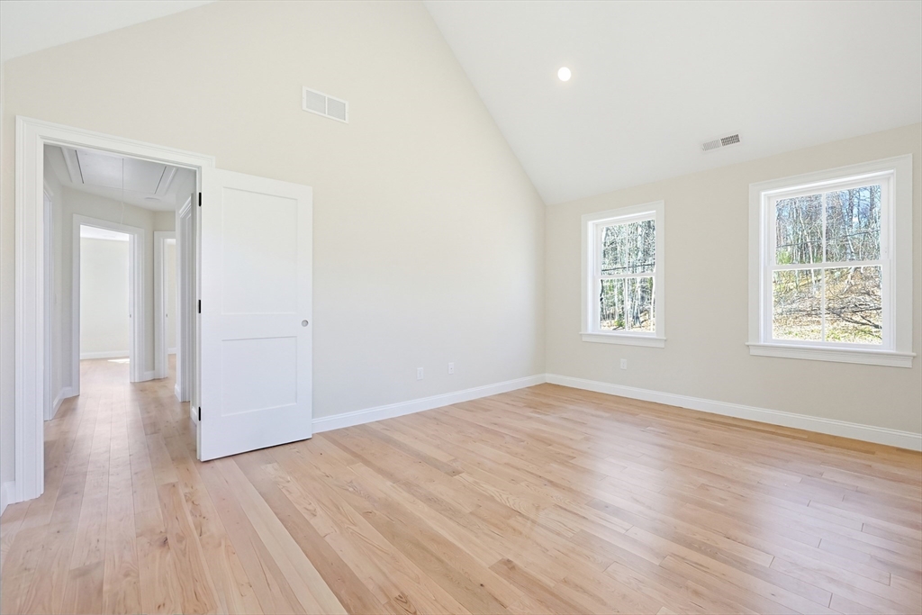 112 West Meadow Road Townsend, MA 01474 - Photo 25 of 38 an empty room with wooden floor and windows