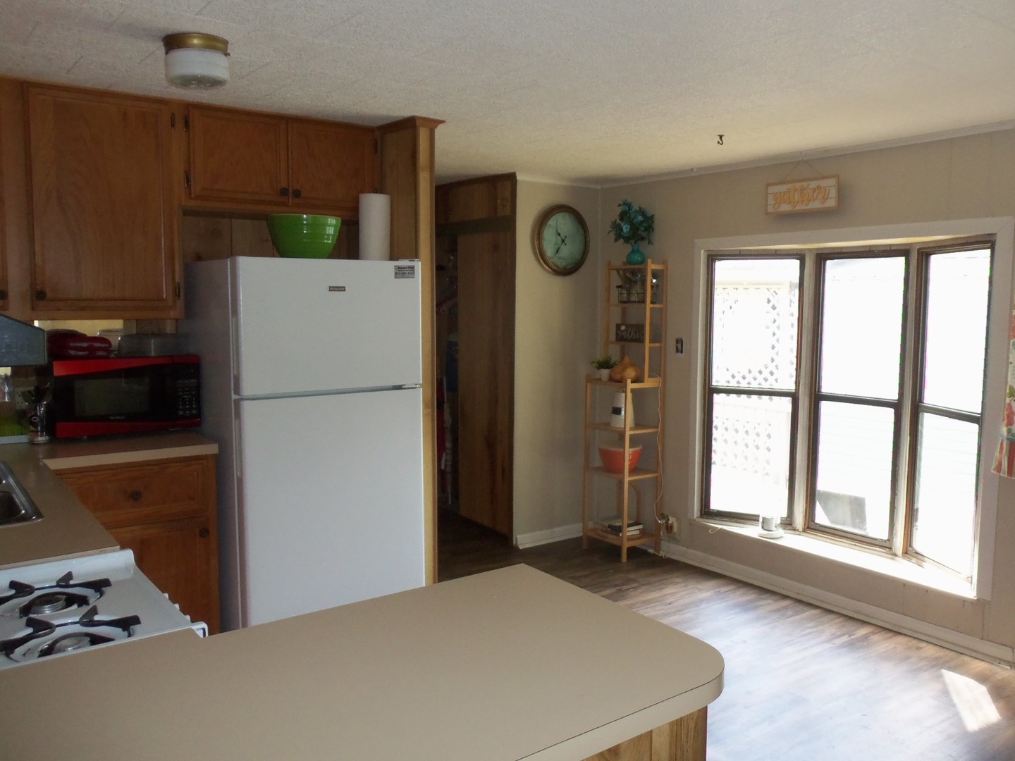 21-216 Woodhaven Sublette, IL 61367 - Photo 16 of 23 a kitchen with a refrigerator and a stove