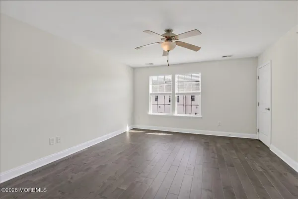a view of a ceiling fan with wooden floor