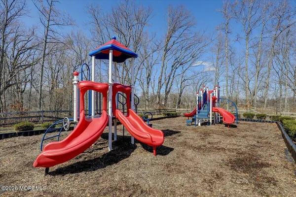 a view of porch with a table and chairs
