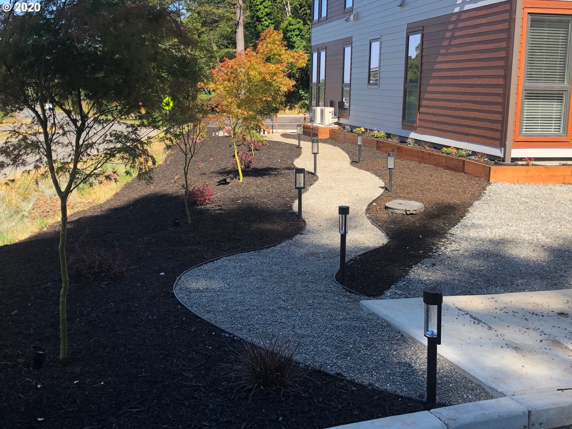 94353 Leith Road Gold Beach, OR 97444 - Photo 11 of 30 a view of a patio with table and chairs with wooden fence