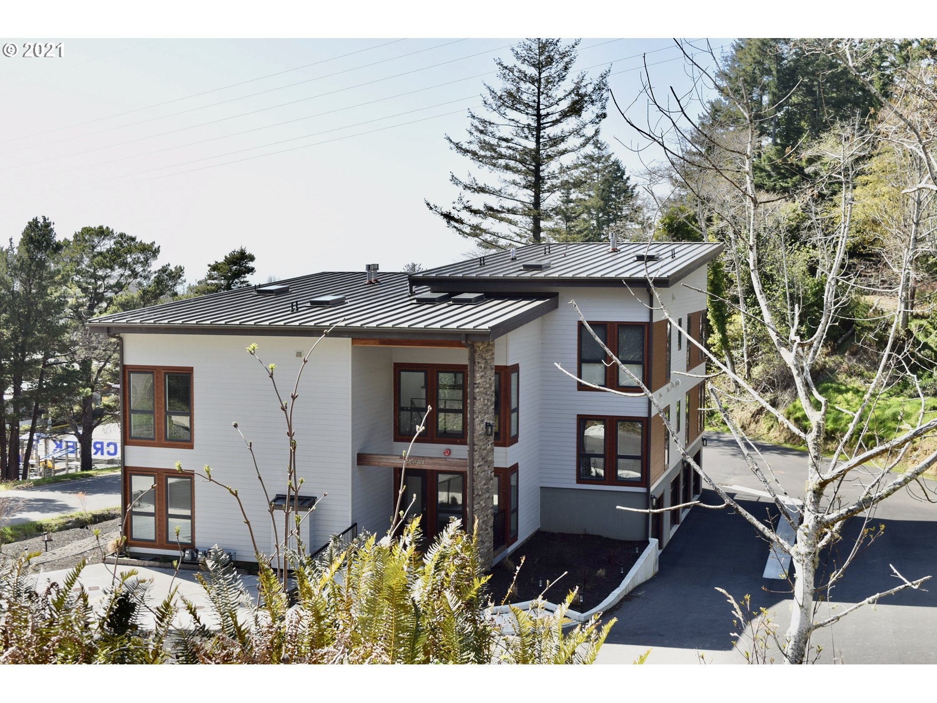 94353 Leith Road Gold Beach, OR 97444 - Photo 17 of 30 a front view of a house with a yard