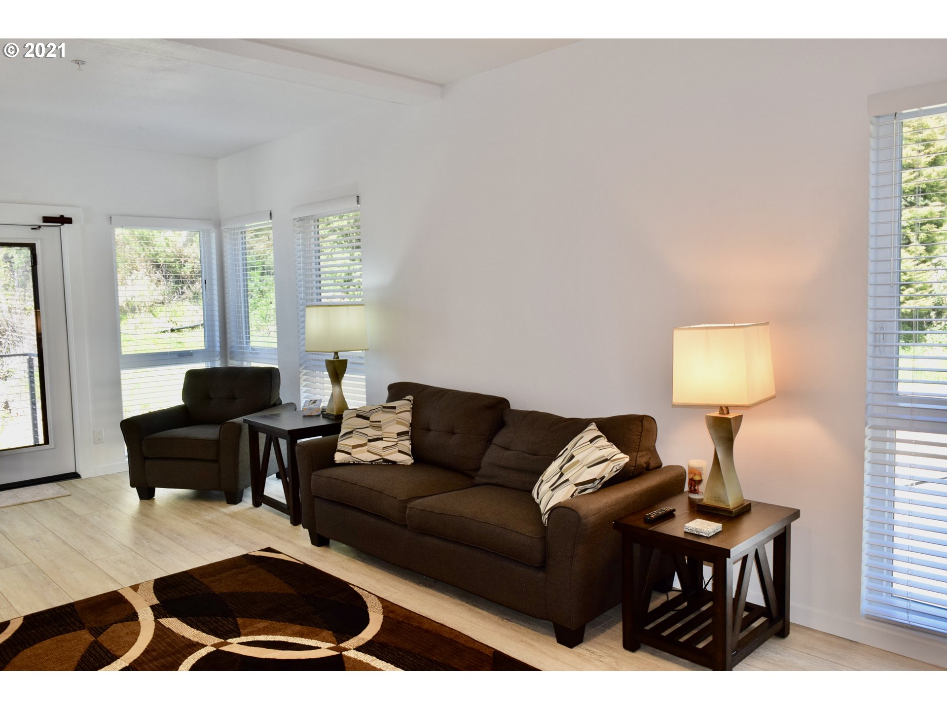 94353 Leith Road Gold Beach, OR 97444 - Photo 22 of 30 a living room with furniture a window and a lamp