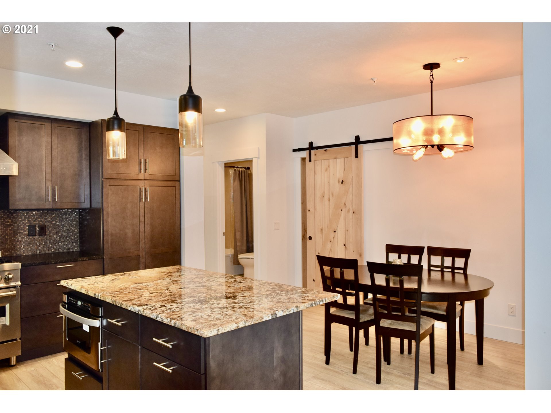94353 Leith Road Gold Beach, OR 97444 - Photo 24 of 30 a kitchen with a table and chairs in it