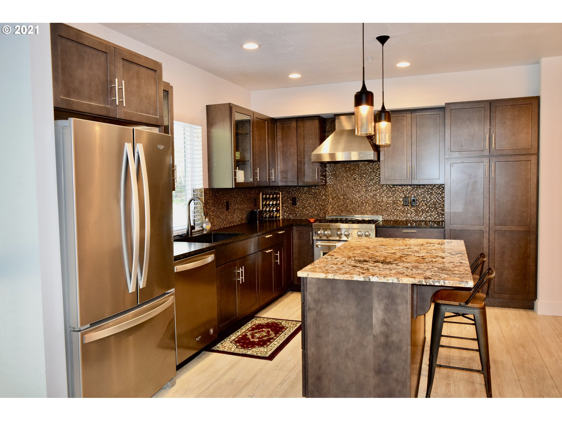 94353 Leith Road Gold Beach, OR 97444 - Photo 26 of 30 a kitchen with stainless steel appliances granite countertop counter space and wooden cabinets