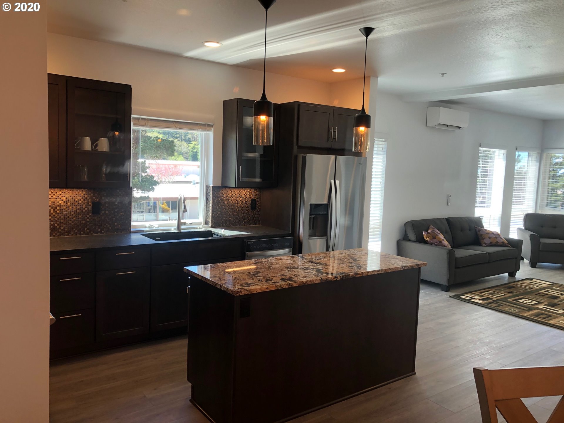 94353 Leith Road Gold Beach, OR 97444 - Photo 4 of 30 a kitchen with stainless steel appliances granite countertop sink stove refrigerator and refrigerator