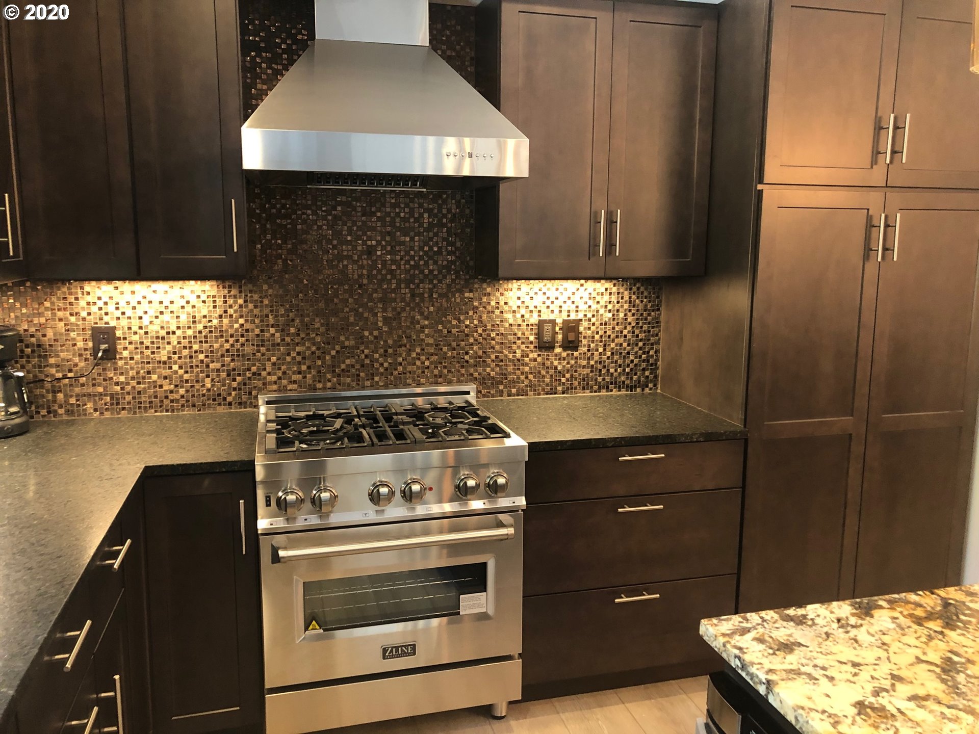 94353 Leith Road Gold Beach, OR 97444 - Photo 8 of 30 a stove top oven sitting inside of a kitchen