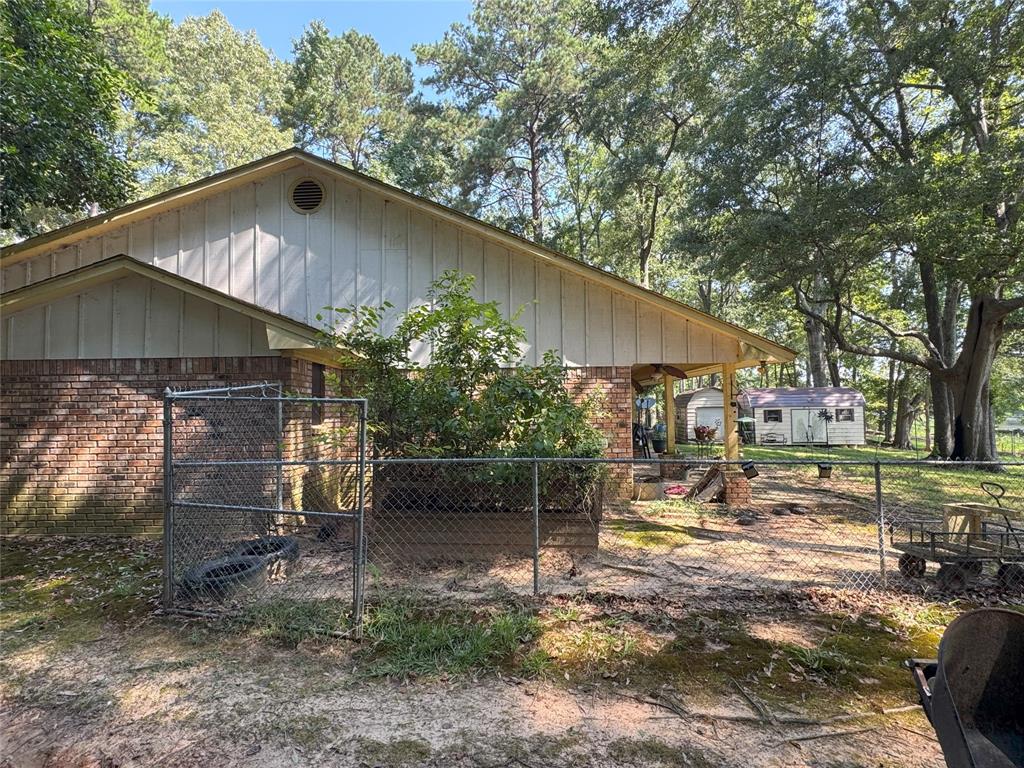 522 Twin Point Drive Benton, LA 71006 - Photo 7 of 33 View of side of home featuring brick siding and a gate