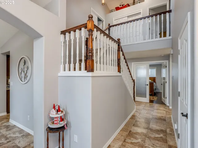 a view of an entryway with wooden floor