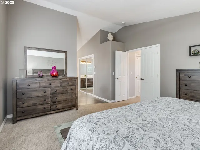 a bed room with a bed and a dresser