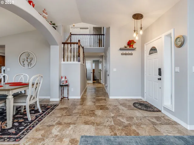 a view of a hallway and dining room