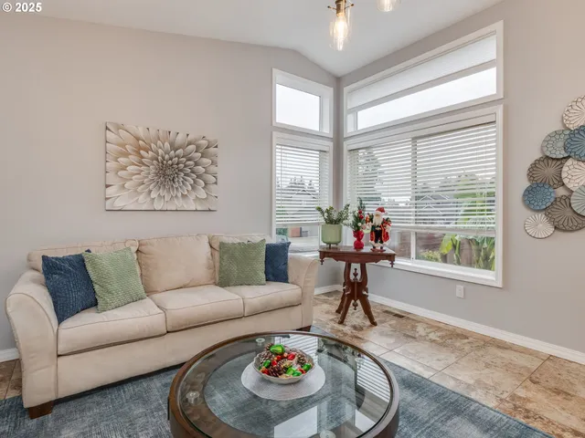 a living room with furniture and a table