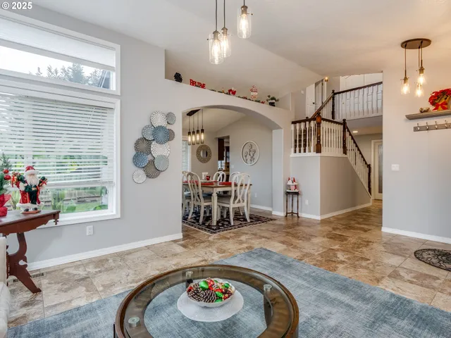 a view of a livingroom with furniture and a window