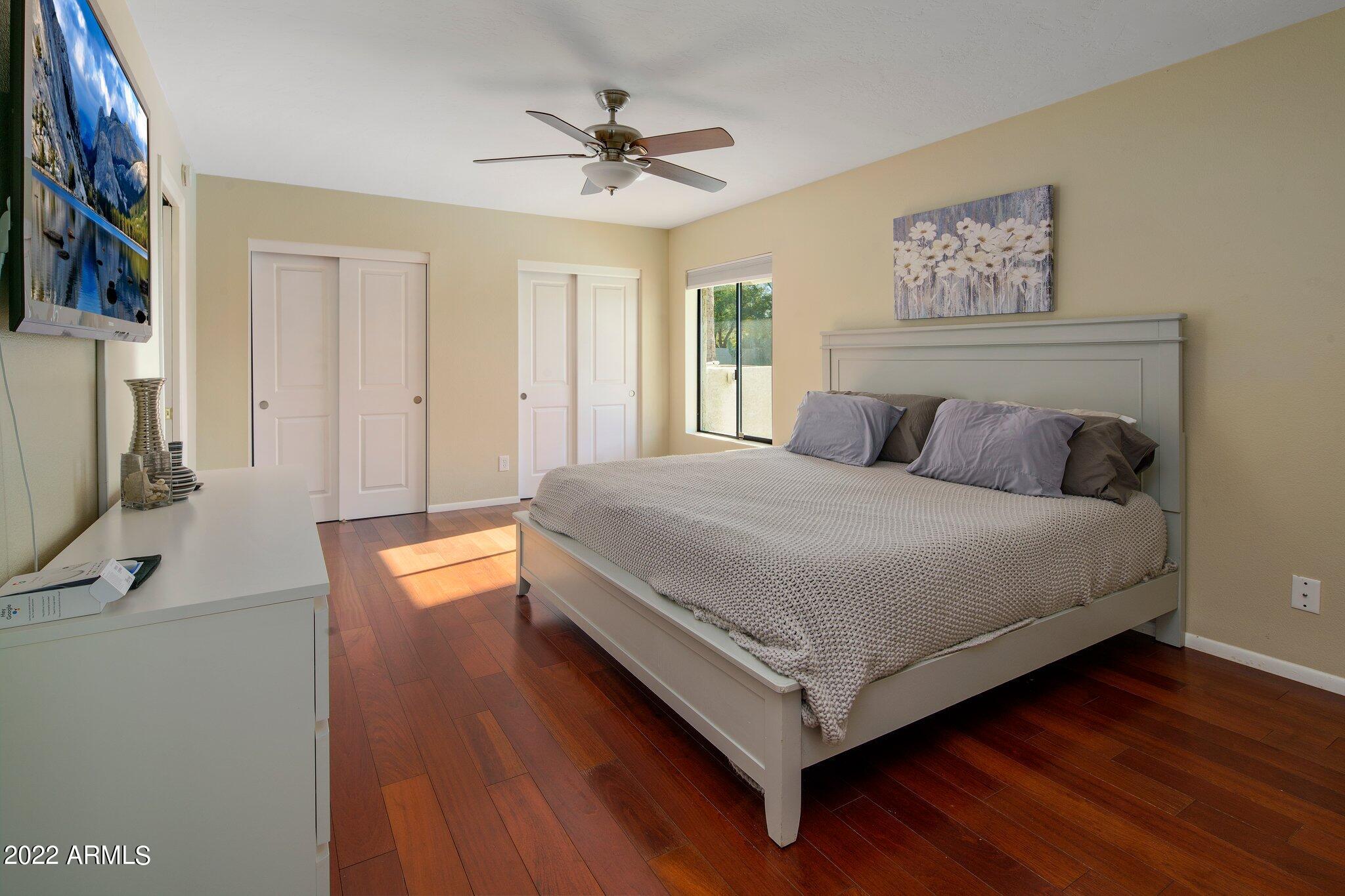 6609 East Phelps Road Scottsdale, AZ 85254 - Photo 52 of 83 a bedroom with a bed and a flat screen tv