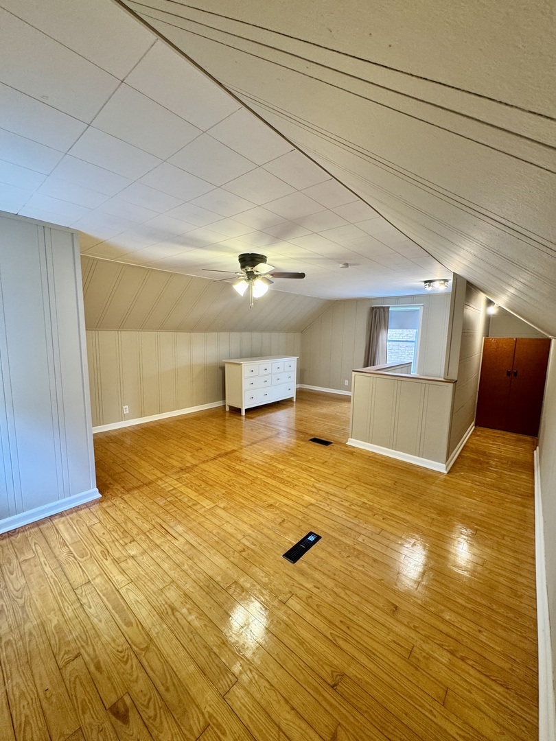 11042 South State Line Road Chicago, IL 60617 - Photo 9 of 12 a view of a room with wooden floor